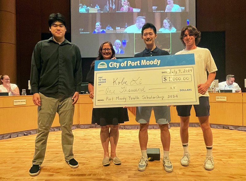 Kobe Li (third from left) receives a $1,000 Youth Scholarship Award from Port Moody City Council and the Youth Focus Committee on July 9, 2024. Pictured are (from l-r) Vincent Zhao (Chair, Youth Focus Committee), Mayor Meghan Lahti, Kobe Li (award recipient) and Jonas McConville (Youth Focus Committee member)