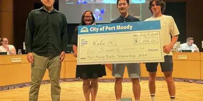 Kobe Li (third from left) receives a $1,000 Youth Scholarship Award from Port Moody City Council and the Youth Focus Committee on July 9, 2024. Pictured are (from l-r) Vincent Zhao (Chair, Youth Focus Committee), Mayor Meghan Lahti, Kobe Li (award recipient) and Jonas McConville (Youth Focus Committee member)