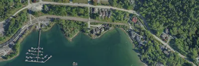 Aerial photo of water, trees, and roads