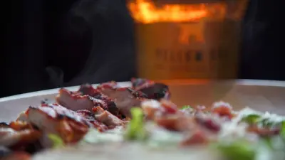 try of appetizers and glass of beer