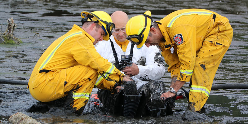 Man getting rescued from mudflats