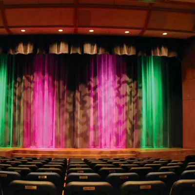 Lit up stage and theatre seating