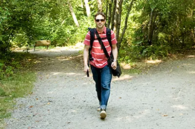 Man walking on gravel path