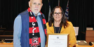 Bob Favelle receives award from Mayor Lahti