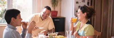 Family eating breakfast at home