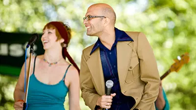 Singers performing on outdoor stage