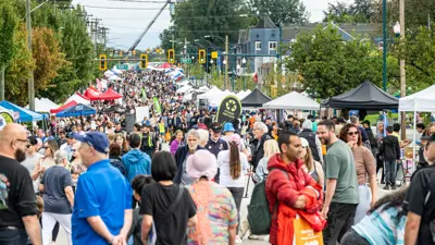 A crowd enjoying car free day along St Johns