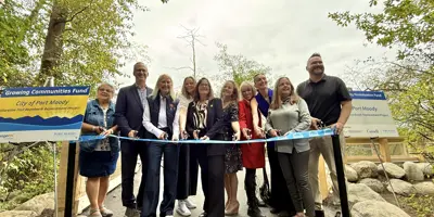 Elder and Knowledge Keeper, Port Moody Council, MLA, MP cut ribbon for opening of new boardwalk