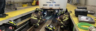 Firefighters training on a SkyTrain track