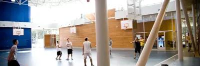 A group of men playing basketball in a gym