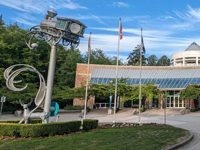 Exterior photo of City Hall with silver train sculpture