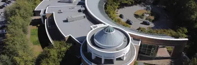 Aerial view looking down at Port Moody City Hall roof and the traffic circle